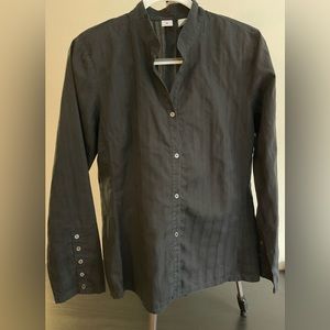 Women’s black long sleeved blouse.